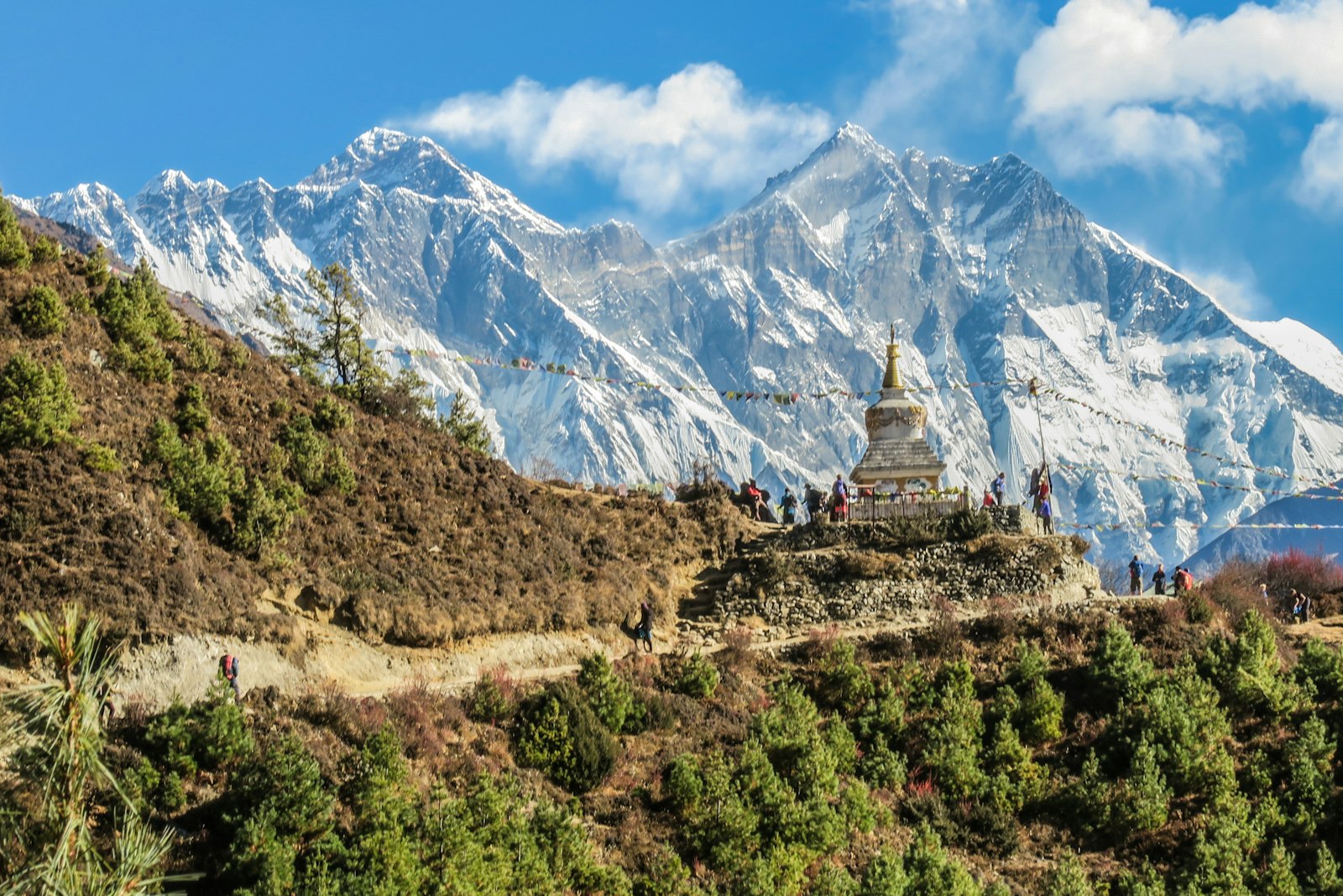 Everest Base Camp trail with Khumbu glacier and Himalayan peaks under blue sky